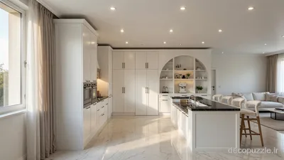 کابینت سفید مات با جزیره، قفسه باز و فر توکار در آشپزخانه‌ای روشن و جادار